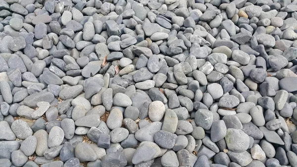 Textur bakgrund: sten stenar, små, rundade, släta Pibbles — Stockfoto