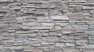 Doku ve arka plan için gri çimento taş duvar soyut