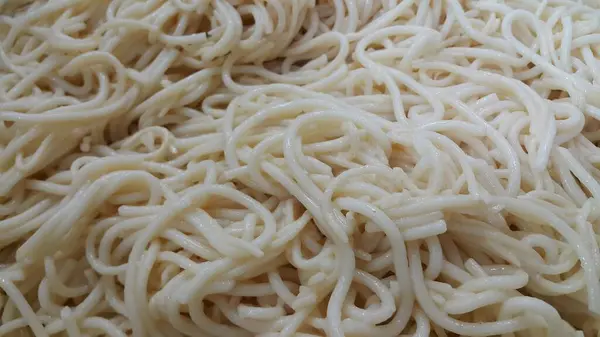 Nahsicht Auf Wirbelnde Nudeln Oder Spaghetti Zum Essen Lebensmittel Hintergrund — Stockfoto