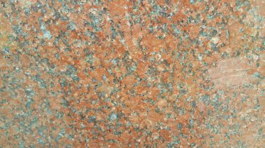 Kırmızı zemin soyut arka plan: Kırmızı beton zeminin yakın dokusu. Kırmızı bir betonun ya da gün ışığındaki duvarın arka planı.