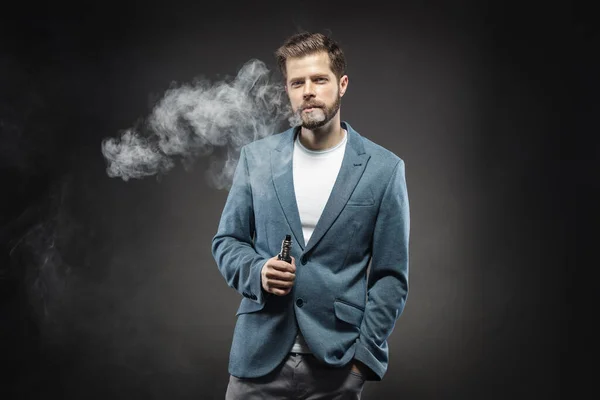 Vaping e-liquid from an electronic cigarette — ストック写真