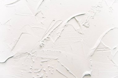 Dekoratif alçı dokusu açık mavi. Duvarda çizikler ve kabartmalar var. Arkaplan.