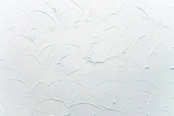 Dekoratif alçı dokusu açık mavi. Duvarda çizikler ve kabartmalar var. Arkaplan.