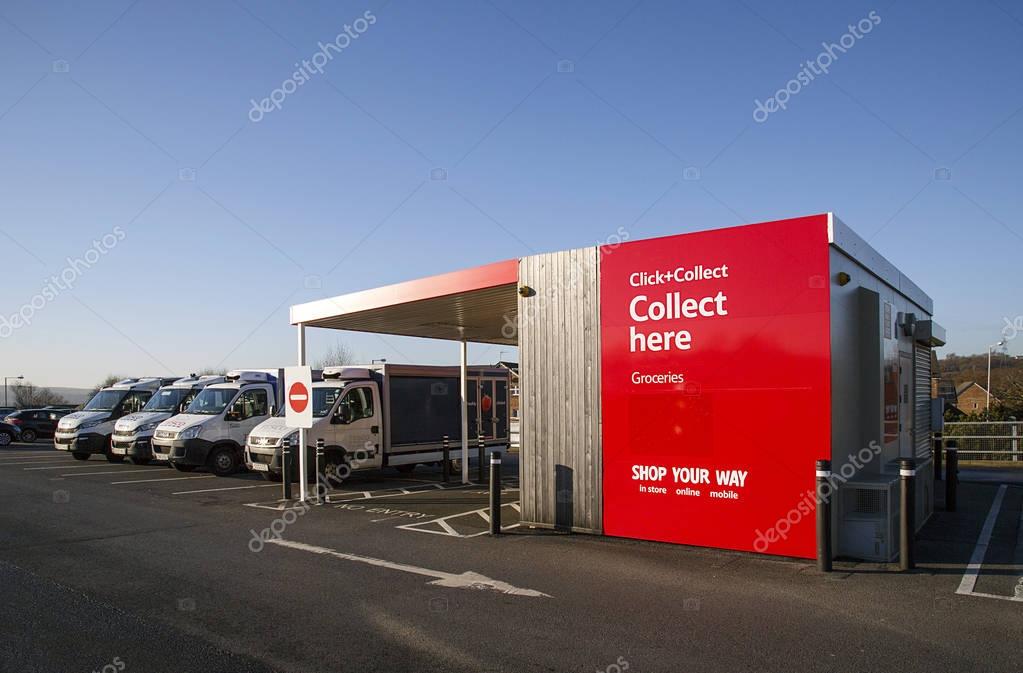 Swansea, UK: December 28, 2016: Tesco delivery vans in front of a click and collect collection building. Shop online at Tesco direct and take advantage of next day Click & Collect