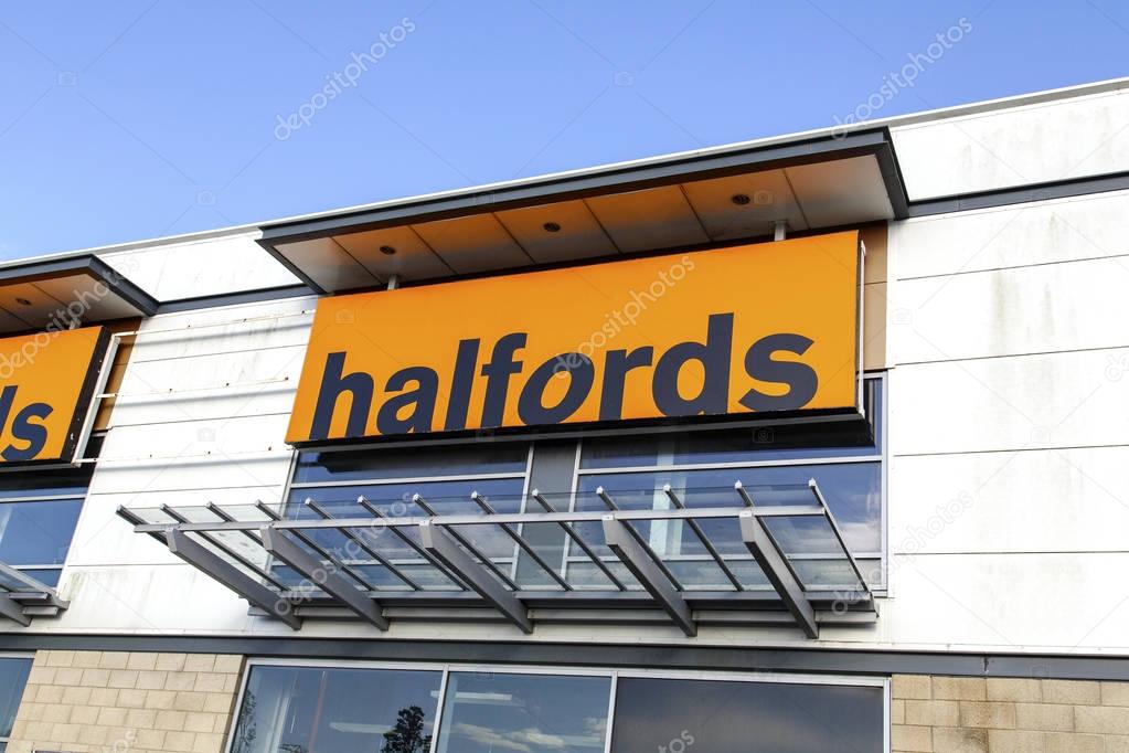 Swansea, UK: May 18, 2016: Halfords shop front. Halfords Group plc is a British retailer of car parts, car enhancement, camping, touring and bicycles operating in the UK and Ireland.