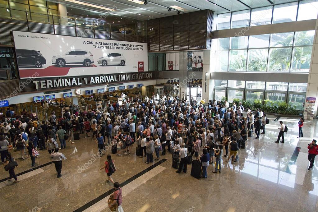 Changi Airport, Singapore: March 05, 2017: People wait to pass through immigration at Changi Airport. Changi Airport is one of the largest transportation hubs in Southeast Asia.