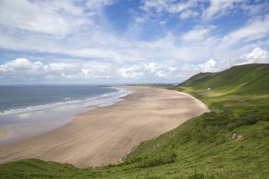 Rhossili Bay Gower Peninsular Batı kıyısında üç mil Kumsalı ve sürekli ilk on Uk plajları popüler