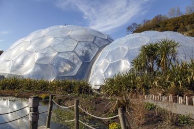 St Austell, Cornwall, United Kingdom: April 13, 2016: View of the biomes at the Eden Project. Inside the biomes, plants from many diverse climates and environments have been collected and are displayed for visitors.  clipart