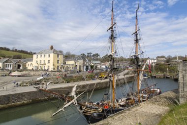 Charlestown, UK: April 12, 2016: The Phoenix is moored at Charlestown. She is a two masted Brig and has appeared in many films such as Ridley Scott's 1492. Built in Denmark in 1929 clipart