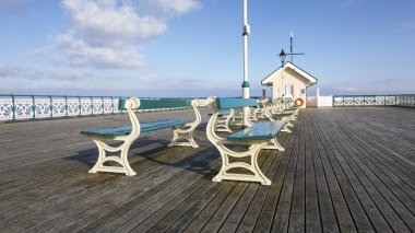 Penarth, UK: March 10, 2016: The Victorian era Penarth Pier in the Vale of Glamorgan was opened in 1894. It is still popular with tourist and locals.  clipart