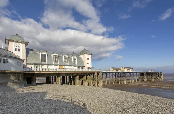 Low tide at the Victorian era Penarth Pier in the Vale of Glamorgan which was opened in 1894. It is still popular with tourist and locals and has a beautifully renovated pavilion including a coffee shop.