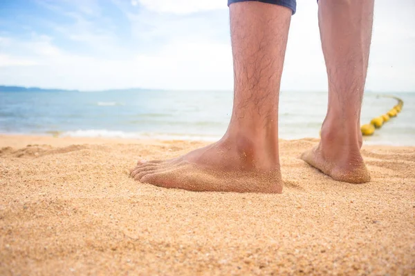 Foot man standing on the beach. — Stock Photo, Image