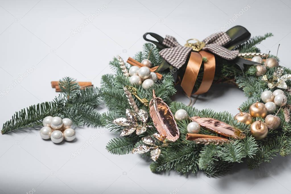 close-up of Christmas wreath with green fir tree branches and decoration