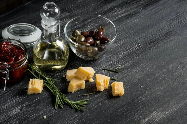 Salami Olives Cheese Olive Oil Black Wooden Table Copy Space — Stock Photo, Image