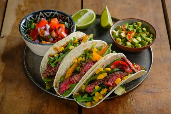 Close Spicy Tacos Lime Slices Cut Vegetables Bowls Wooden Table — Stock Photo, Image