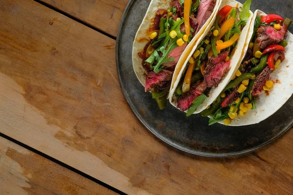 Delicious Tacos Black Plate Wooden Background — Stock Photo, Image