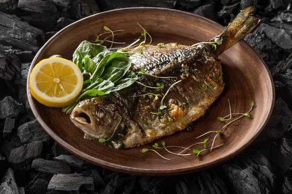 Plate with fish and herbs cooking on coal, close up — Stock Image Plate Fish Herbs Cooking Coal Close Royalty Free Stock Photos