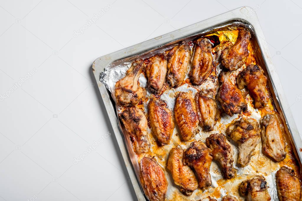 top view of roasted chicken wings on tray
