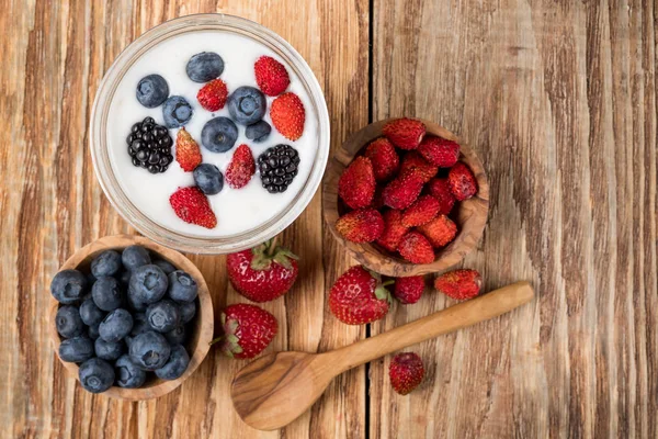 Yogurt Glass Berries Bowls Strawberries Blueberries Wooden Spoon Table Top — Stock Photo, Image