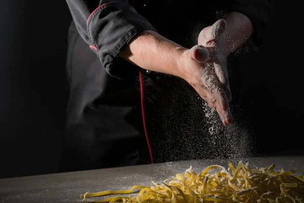 Hands Chef Cooking Pasta Spaghetti Powdering Flour Dark Black Background — Stock Photo, Image