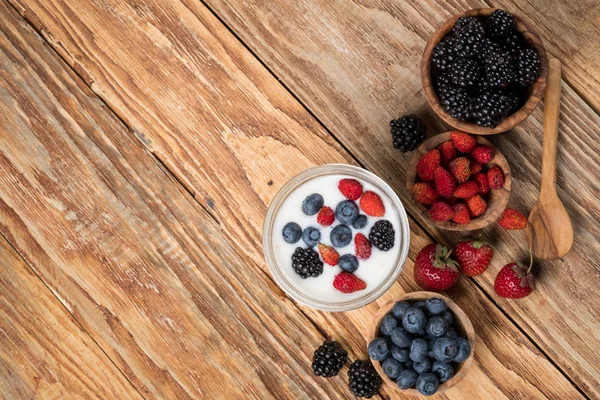 Yogurt Glass Berries Wooden Bowls Spoon Table Top View Copy — Stock Photo, Image