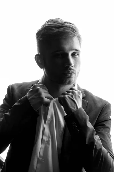 Monochrome Portrait Young Man Suit Holding Collar His Shirt — Stock Photo, Image