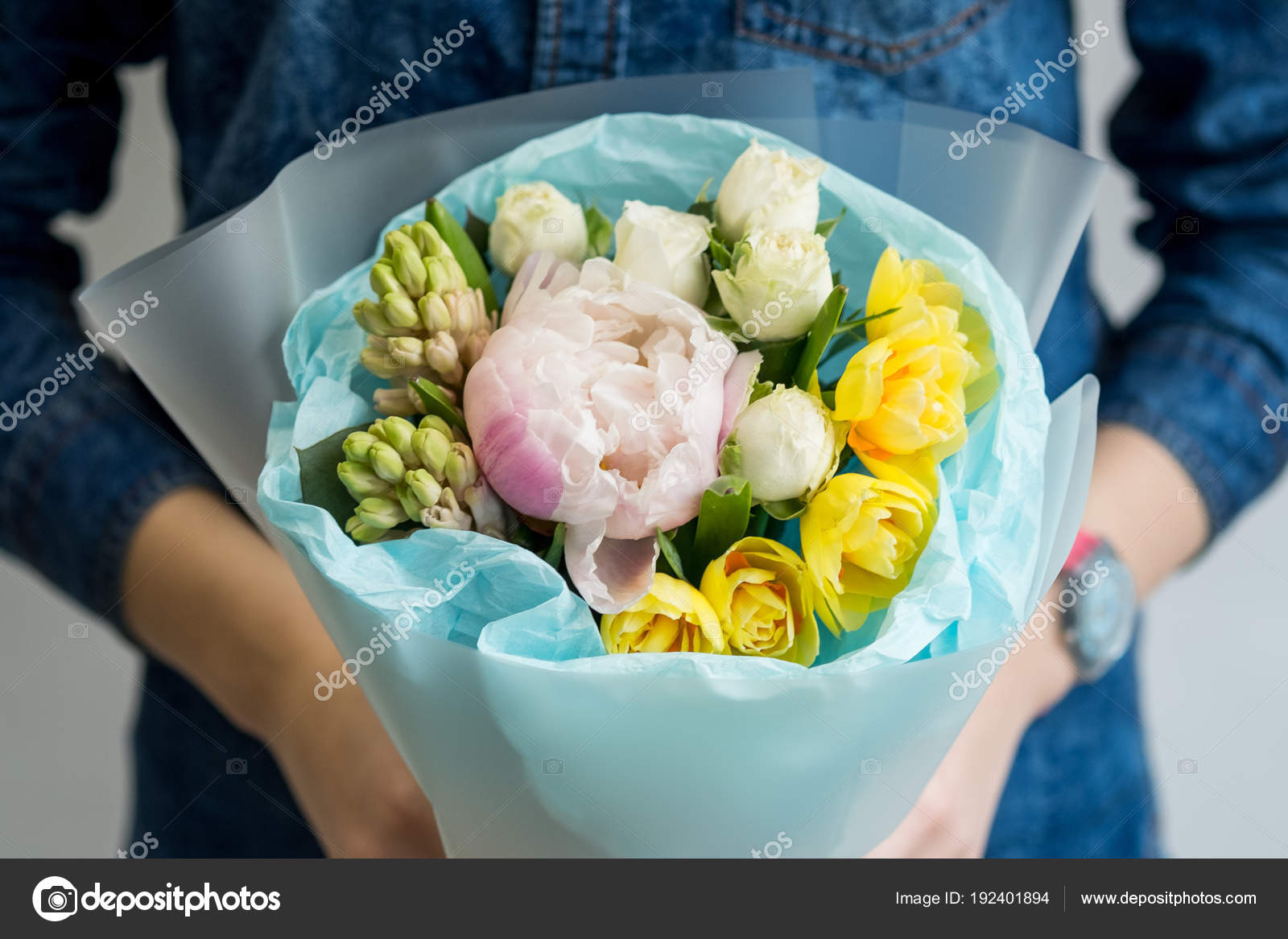 Woman holding beautiful bouquet of bright spring flowers