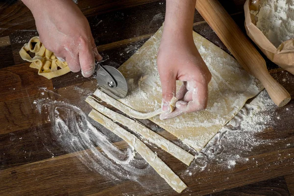 Close Photo Male Holding Knife Cut Dough Tasty Pasta Wooden — Stock Photo, Image