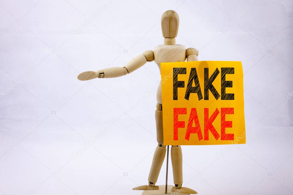 Conceptual hand writing text caption inspiration showing Fake News Business concept for Fake News written on sticky note sculpture background with space