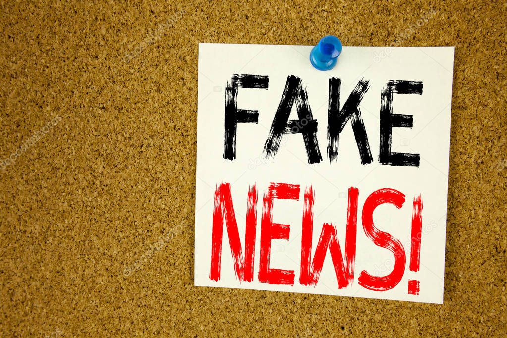 Conceptual hand writing text caption inspiration showing Fake News. Business concept for Propaganda Newspaper Fake News written on sticky note, reminder cork background with copy space