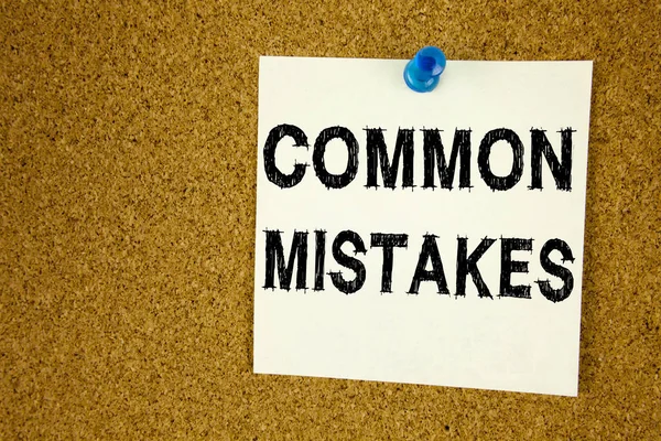 Conceptual hand writing text caption inspiration showing Common Mistakes. Business concept for Common Decision Mistakes written on sticky note, reminder cork background with copy space — Stock Photo, Image