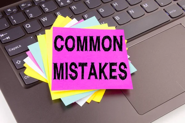 Writing Common Mistakes text made in the office close-up on laptop computer keyboard. Business concept for Common Decision Mistakes Workshop on the black background with copy space — Stock Photo, Image