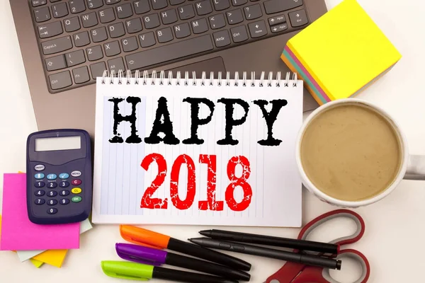 Word writing Happy 2018 in the office with surroundings such as laptop, marker, pen, stationery, coffee. Business concept for Holiday Celebration Workshop white background with copy space — Stock Photo, Image