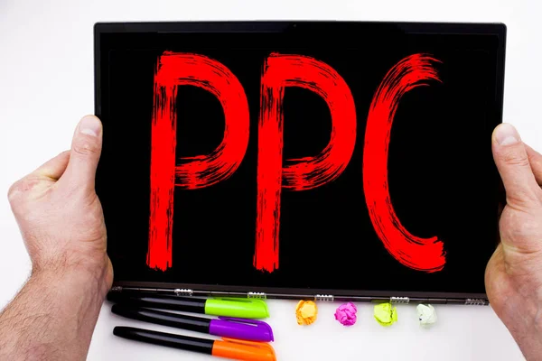 PPC - Pay per Click text written on tablet, computer in the office with marker, pen, stationery. Business concept for Internet SEO Money white background with copy space