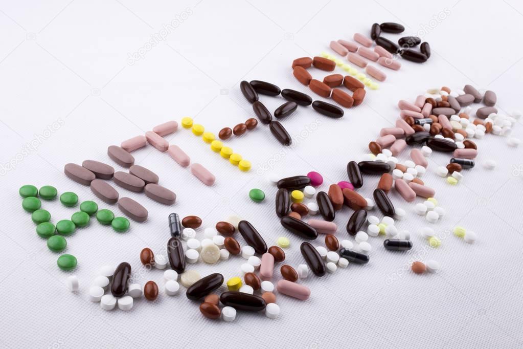 Hand writing text caption inspiration Medical care concept written with pills drugs capsule word stop aging forever young age feel anti aging On white isolated background with copy space