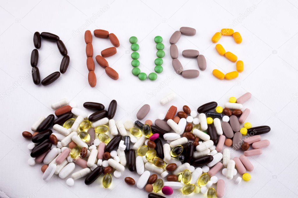 Conceptual Hand writing text caption inspiration Medical care Health concept written with pills drugs capsule word drug On white isolated background with copy space