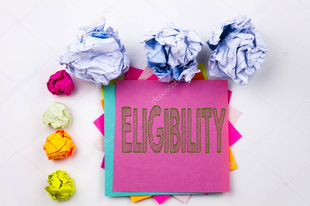 Writing text showing Eligibility written on sticky note in office with screw paper balls. Business concept for Suitable Eligible Eligibility on the white isolated background.