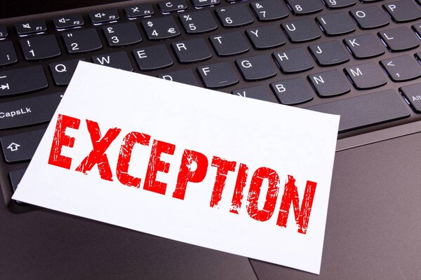 Writing Exception text made in the office close-up on laptop computer keyboard. Business concept for Exceptional Exception Management,  Workshop on the black background with copy space