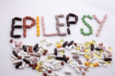 Conceptual Hand writing text caption inspiration Medical care Health concept written with pills drugs capsule word epilepsy On white isolated background with copy space clipart
