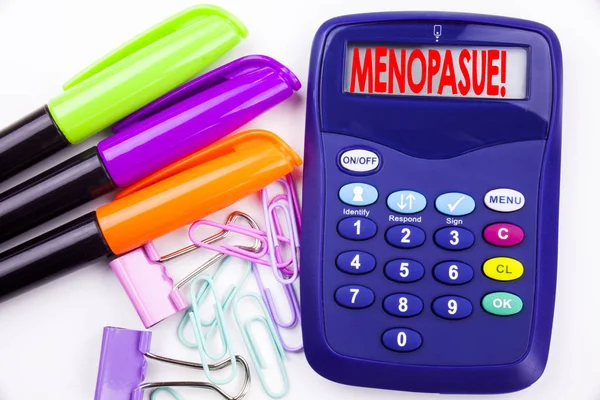 Writing word Menopause text in the office with surroundings marker, pen writing on calculator. Business concept for Midlife Crisis Grand Climacteric white background with copy space — Stock Photo, Image