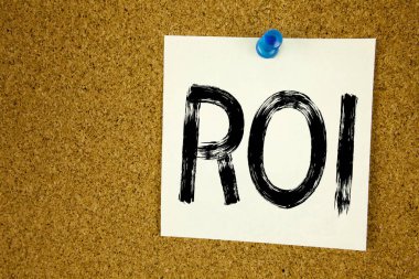 Kavramsal el ROI gösterilen metin resim yazısı ilham yazma. Yapışkan Not, hatırlatma mantar arka plan kopya alanı ile yazılı yatırım getirisi için iş kavramı