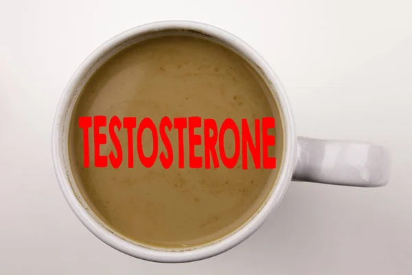 Slovo, psaní textu testosteronu v kávy v šálku. Obchodní koncept pro hormon molekulu mužské steroidu na bílém pozadí s kopie prostoru. Černý text s červeným slovem. — Stock fotografie