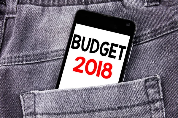 Conceptual hand writing text caption showing Budget 2018. Business concept for Household budgeting accounting planning written mobile cell phone with space in the back pants trousers pocket