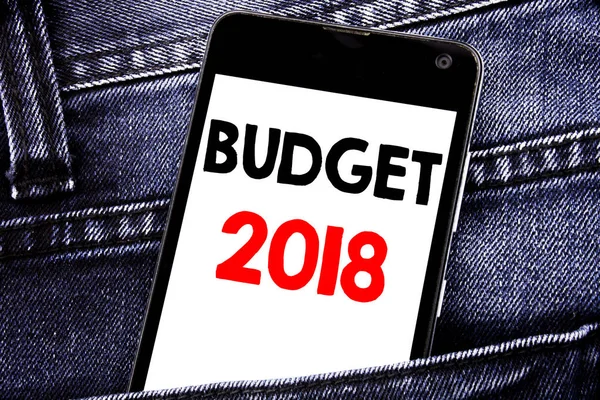 Writing text showing Budget 2018. Business concept for Household budgeting accounting planning written mobile cell phone with space in the back pants trousers pocket
