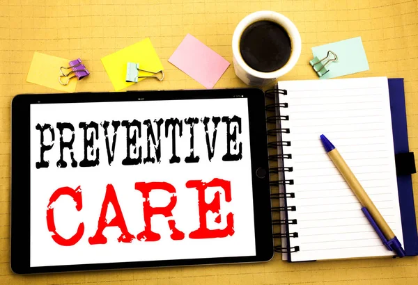 Preventive Care. Business concept for Health Medicine Care Written on tablet laptop, wooden background with sticky note, coffee and pen