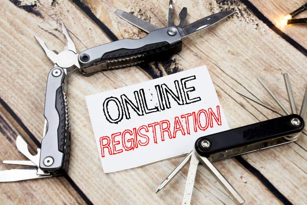 Conceptual hand writing text caption inspiration showing Online Registration. Business concept for Internet Login Written on sticky note wooden background with pocket knife