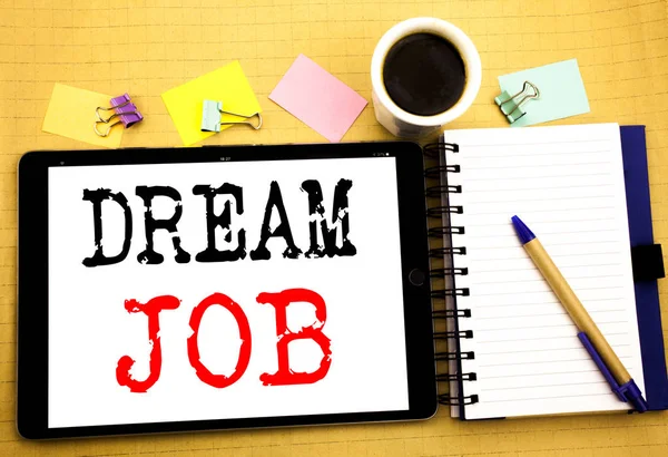 Dream Job. Business concept for Dreaming about Employment Job Position Written on tablet laptop, wooden background with sticky note, coffee and pen