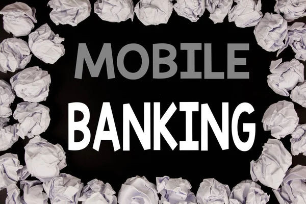 Word, writing Mobile Banking. Business concept for Internet Banking e-bank written on black background with copy space on old background with folded paper balls