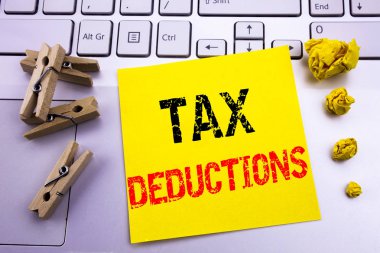 Hand writing text caption inspiration showing Tax Deductions. Business concept for Finance Incoming Tax Money Deduction written on sticky note paper on the white keyboard background. clipart