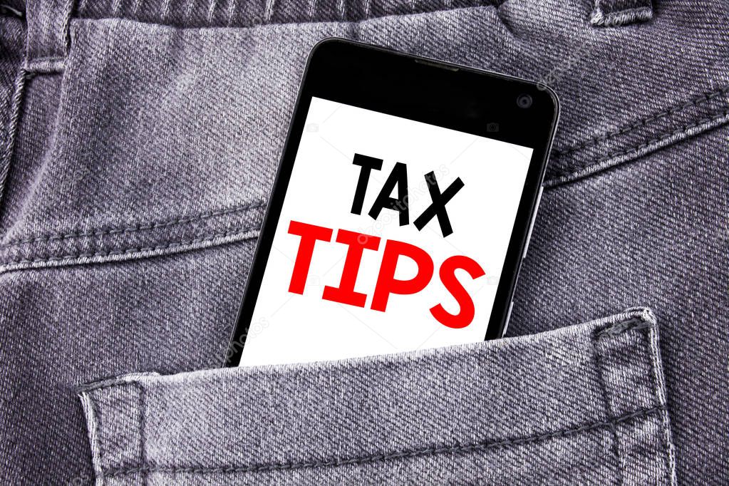 Conceptual hand writing text caption showing Tax Tips. Business concept for Taxpayer Assistance Refund Reimbursement written mobile cell phone with copy space in the back pants trousers pocket